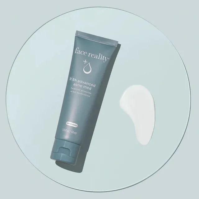 Face Reality 2.5% Advanced Acne Med tube with product sample on pale background, skincare product